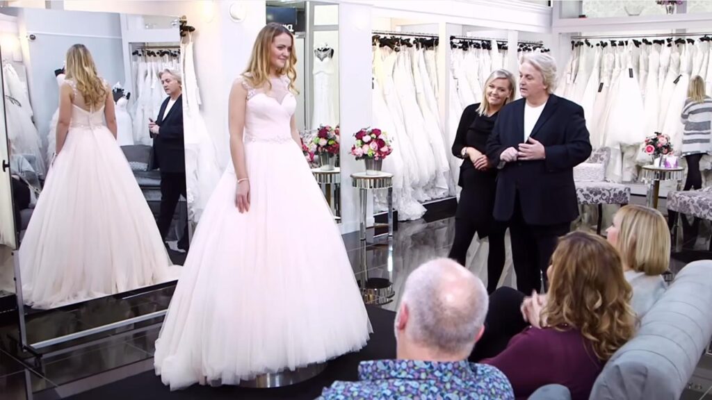 Bride Fiona wears a massive pink princess ball gown wedding dress to please her mother