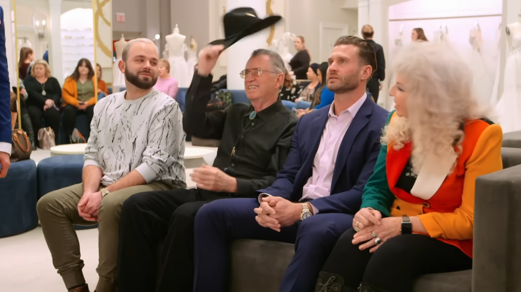 Cowboy dad takes off his lucky hat for his daughter's wedding dress