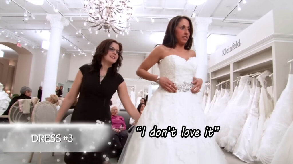 Bride realizing her haute couture bridal wear is not flattering for her body type.