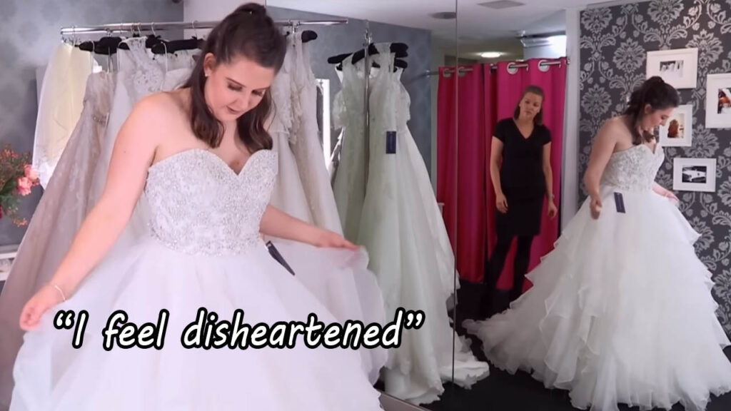 Frustrated bride feeling disheartened while trying on dresses at a luxury bridal boutique.