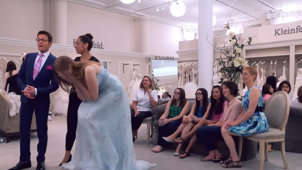 The bride's family reacts negatively to a low-cut floral wedding dress