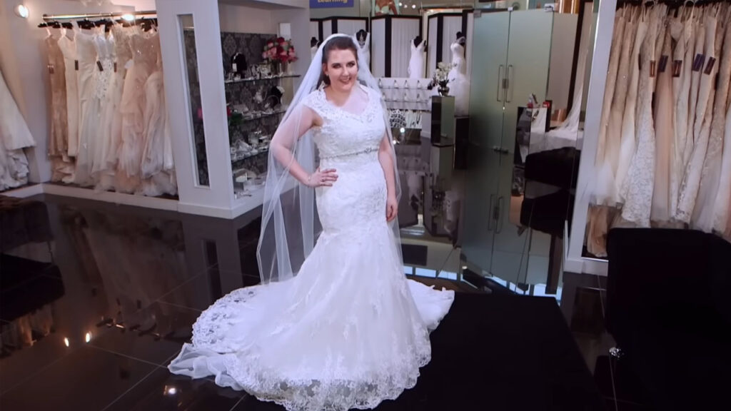 Beautiful bride looking stunning in a fitted fishtail bridal gown.