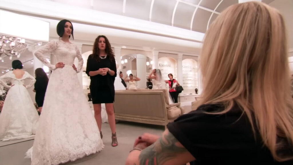Bride feeling like a grandma during her traditional wedding dress fitting appointment.