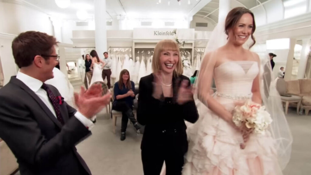 Bride finally saying yes to a blush pink designer wedding dress.