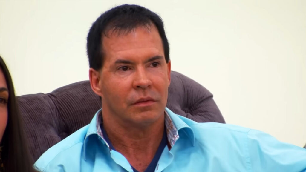 Controlling groom insults his bride's custom designer wedding dress for showing cleavage.
