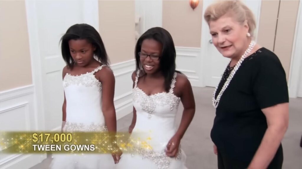 Two young girls wearing custom mini Pnina Tornai wedding dresses at Kleinfeld bridal salon.